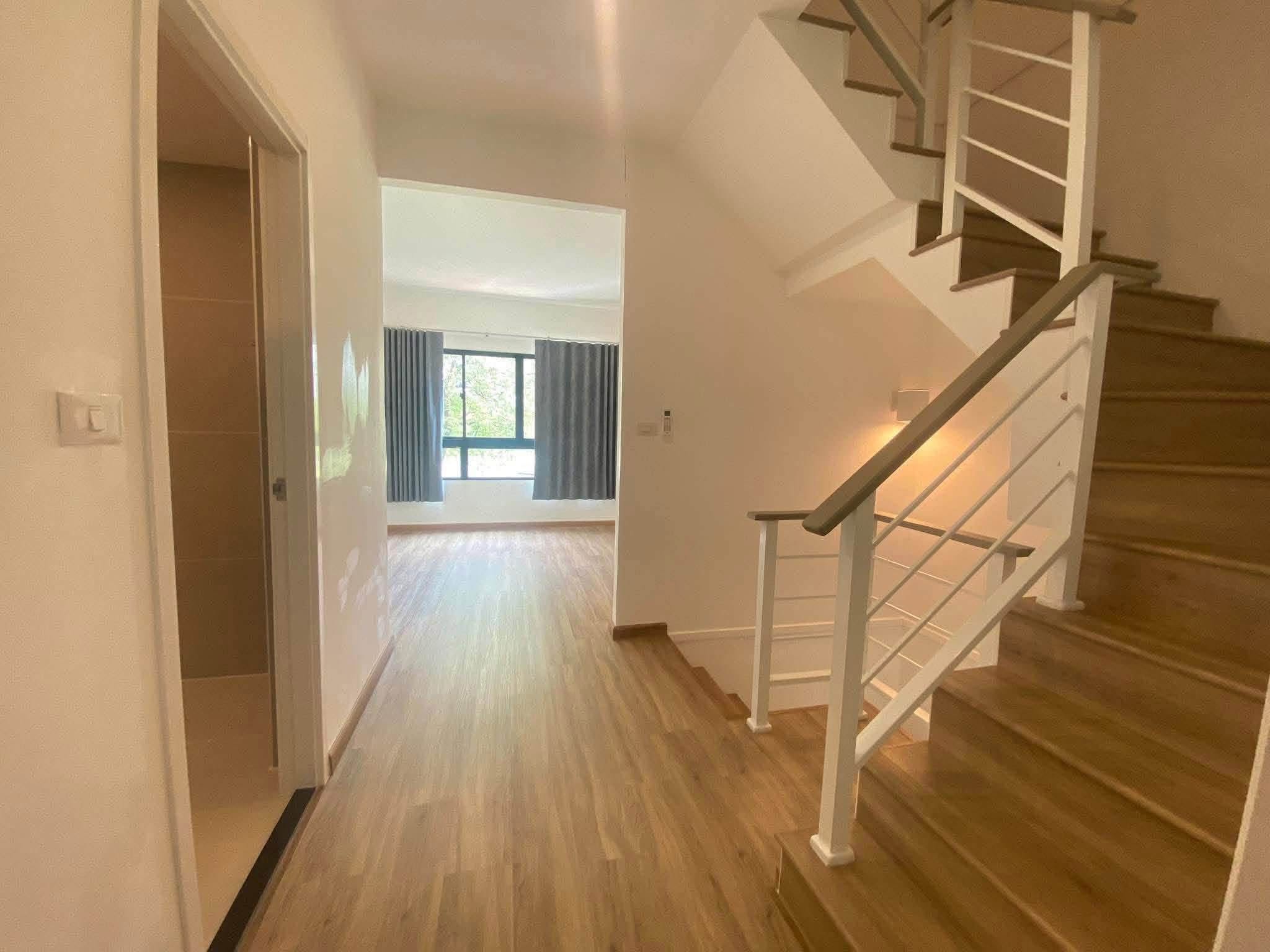 Upstairs stair hall with wood floor