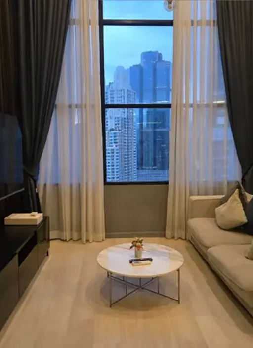Living room of the 1-bedroom condo (37.95 sq.m.) at Knightsbridge Prime Sathorn