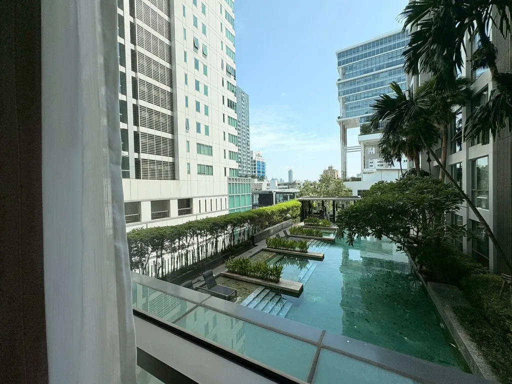 Shared swimming pool at Quattro By Sansiri