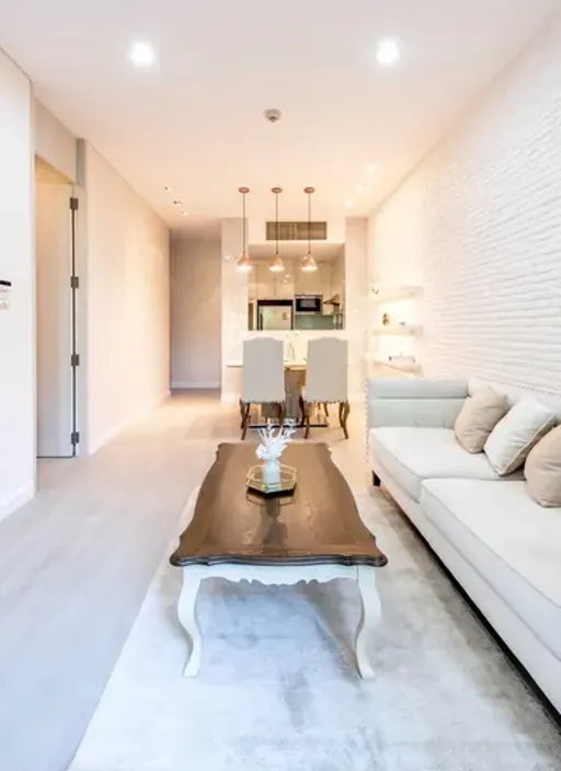 Living room of the 1-bedroom condo (59.46 sq.m.) at Vincente Sukhumvit 49 Condominium