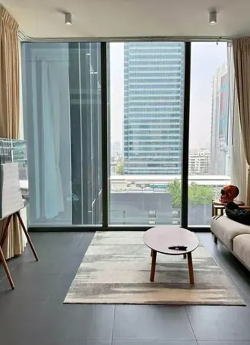 Living room of the 2-bedroom condo (72.5 sq.m.) at Tait Sathorn 12