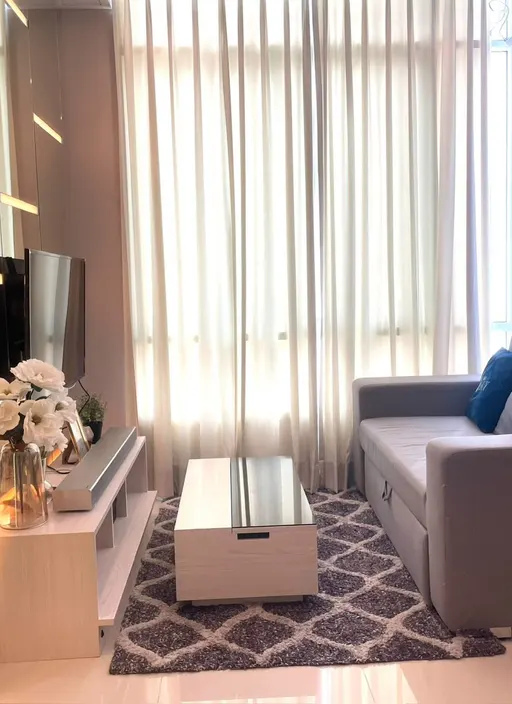 Living room of the 1-bedroom condo (34.75 sq.m.) at The Sky Sukhumvit