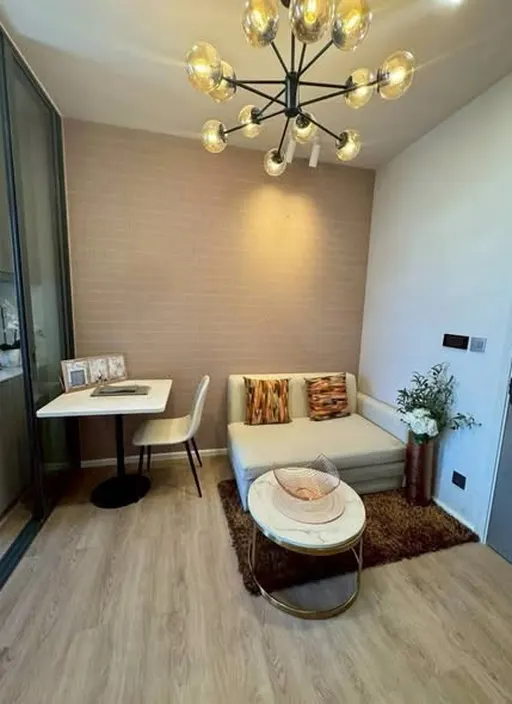 Living room of the 1-bedroom condo (26 sq.m.) at Modiz Rhyme Ramkhamhaeng