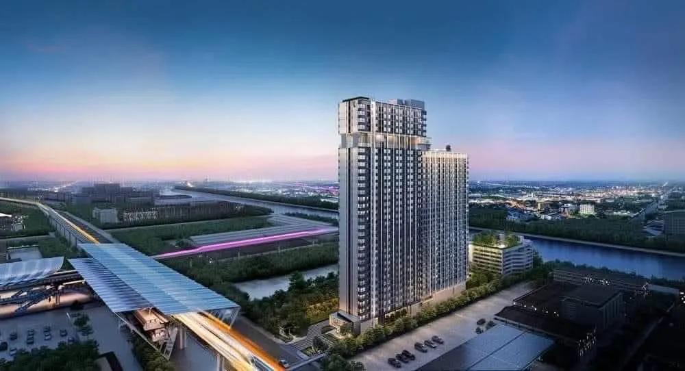 Aerial view of a high-rise condominium beside an elevated monorail station in Min Buri, the end of the MRT Pink Line (article illustration)