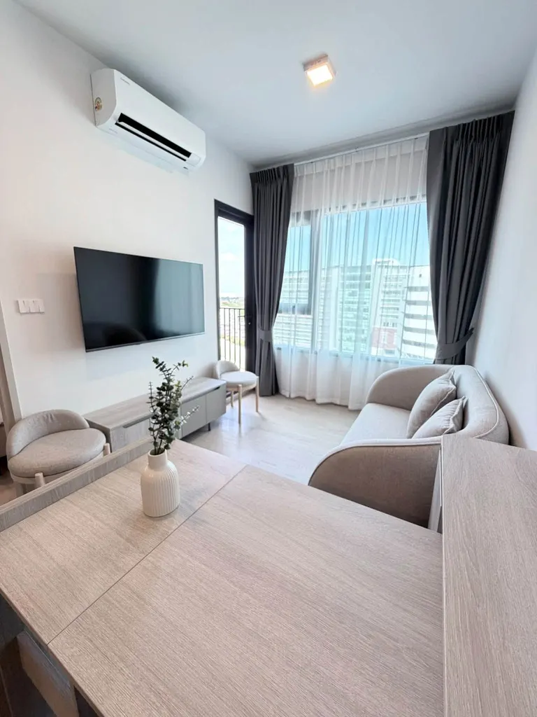 Living room of the 1-bedroom condo (30.4 sq.m.) at COBE Kaset-Sripatum