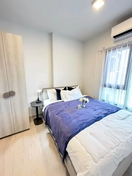 Bedroom of the 1-bedroom condo (30.4 sq.m.) at COBE Kaset-Sripatum