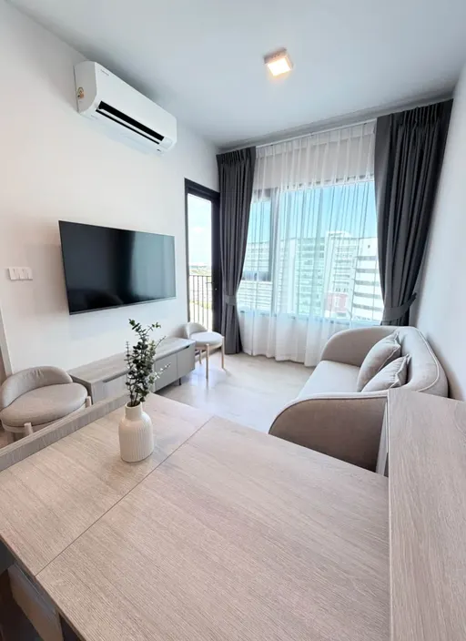 Living room of the 1-bedroom condo (30.4 sq.m.) at COBE Kaset-Sripatum